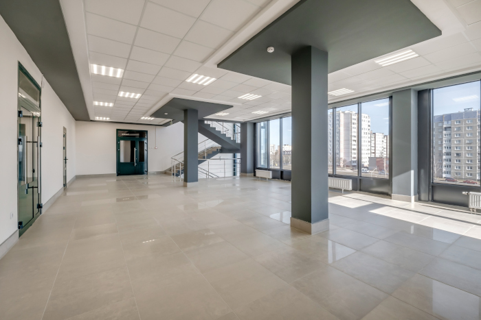 empty modern hall room with columns, doors and panoramic windows office fit outs